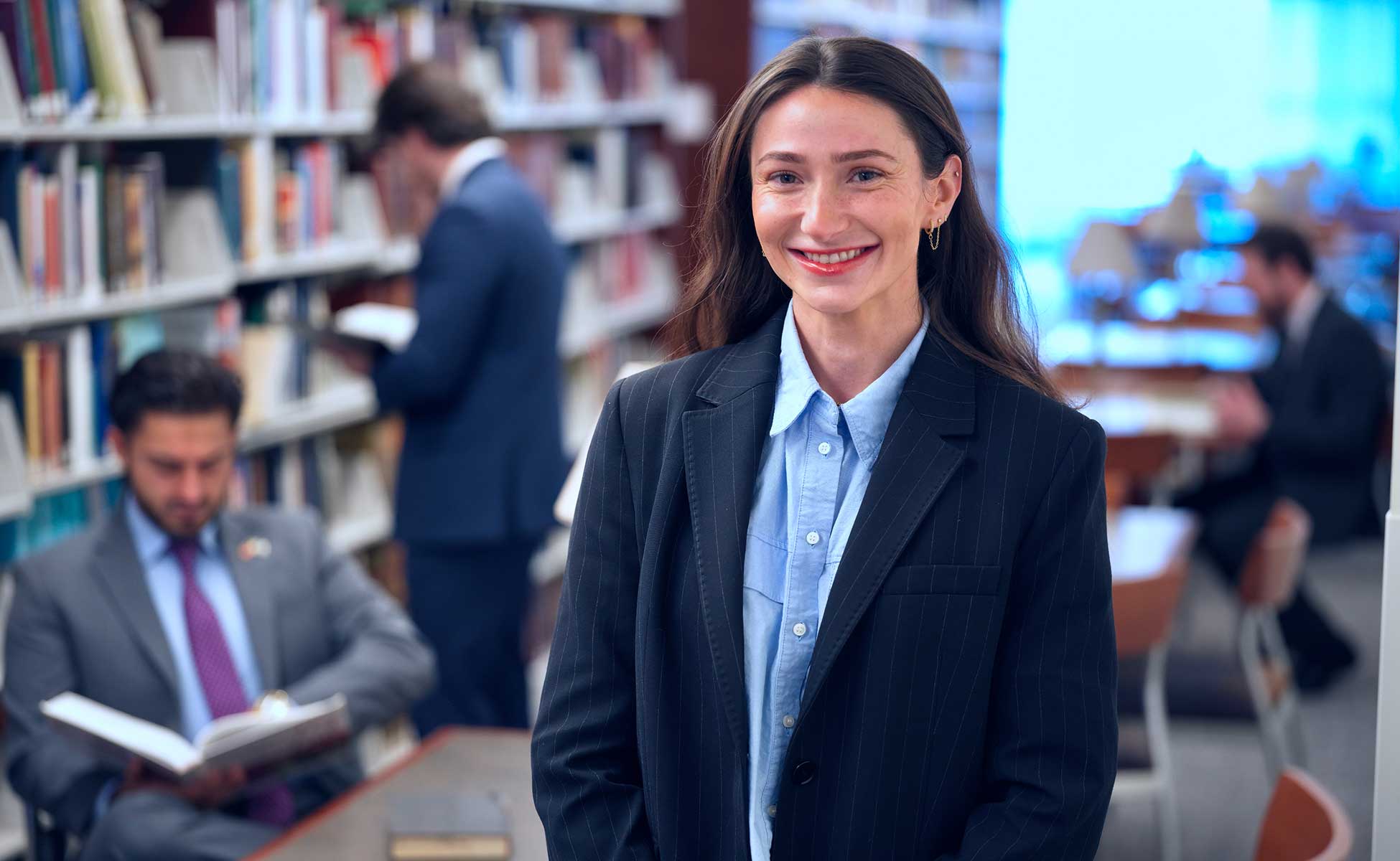 Touro Law student wearing suit and smiling on campus