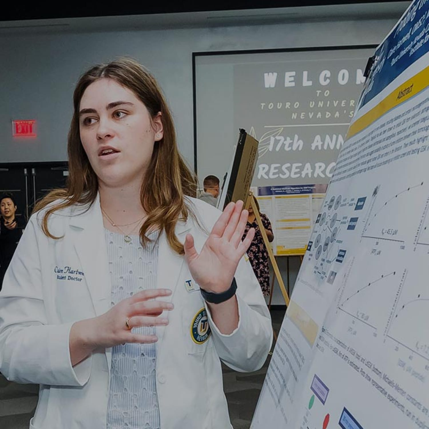 TUN student presenting a research poster